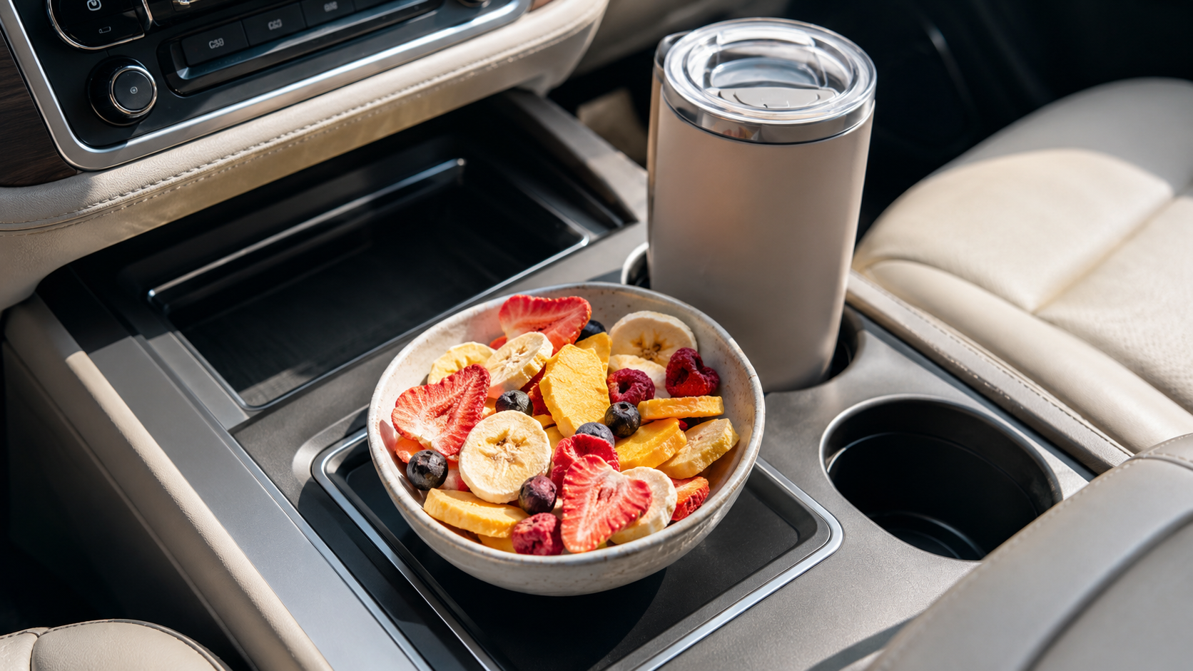 Freeze-dried fruit styled as a bright road-trip snack near a car console in airy pink and lavender tones